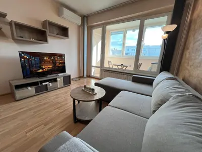 a living room with a couch and a tv at Lima 2BDR cozy Apt near Business Park w Work Desk in Sofia