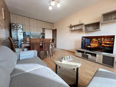 a living room with a couch and a tv at Lima 2BDR cozy Apt near Business Park w Work Desk in Sofia