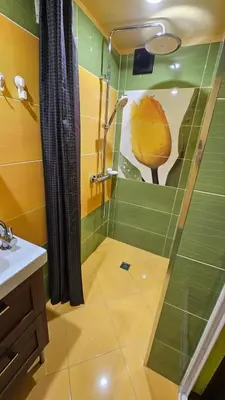 a bathroom with a shower and a sink at Cozy spot at the heart of Sofia in Sofia