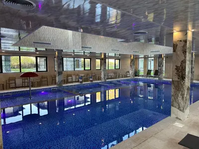 a large swimming pool in a large building at Devin River in Devin