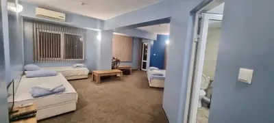 a hospital room with two beds and a bathroom at Julia rooms in Sofia
