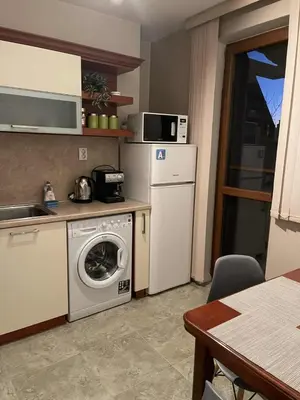 a kitchen with a washing machine and a dishwasher at Heart of Plovdiv - 2 bedrooms, Private garage in Plovdiv