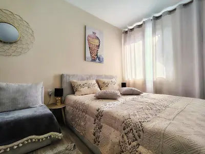 a bedroom with a bed and a window at Charming Studio 88 in Bansko
