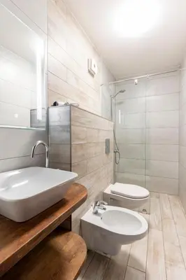 a white bathroom with a sink and a toilet at Luna Penthouse Stunning Sofia Skyline plus FREE Parking in Sofia