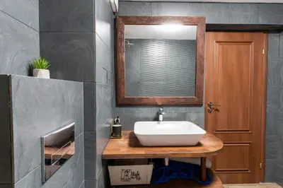 a bathroom with a sink and a mirror at Luna Penthouse Stunning Sofia Skyline plus FREE Parking in Sofia