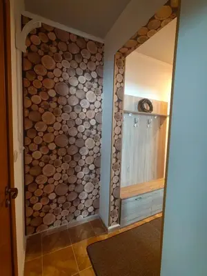 a walk in shower with a wall of logs at Sunny Mountain View Villa Kometa in Pamporovo