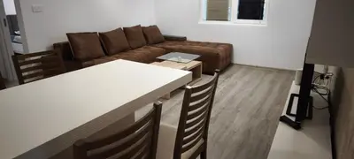 a living room with a couch and a table at Two-Bedroom Apartment Lauta Park 6 Plovdiv in Plovdiv