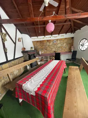 a room with a table with a blanket on it at Райска тишина in Zlatitsa