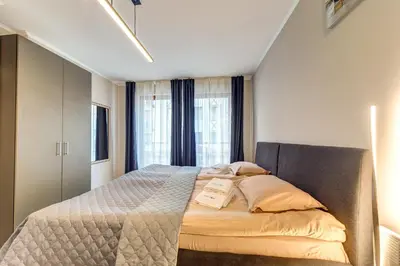 a bedroom with a bed with two boxes on it at Studio in Dream View Resort in Pamporovo