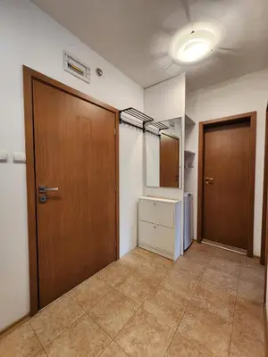 an empty room with two doors and a closet at Apartment Viktoria near ski lift on Pirin street in Bansko