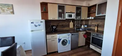 a kitchen with a refrigerator and a washing machine at Grand Monastery 3 Apartment 10 in Pamporovo