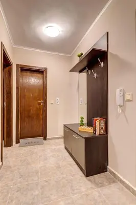 a large room with a counter and a door at Ski Slope Retreat at Dream View in Pamporovo