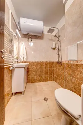 a bathroom with a toilet and a sink at Ski Slope Retreat at Dream View in Pamporovo
