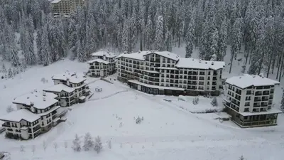 an aerial view of a resort in the snow at Elit Pamporovo Apartments in Pamporovo