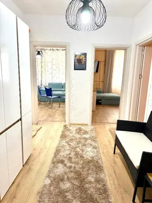 a living room with a couch and a table at Atelier-apartament in Sandanski