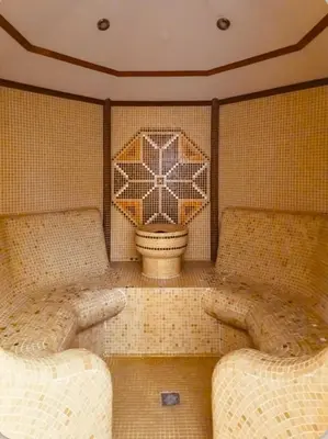 a room with two chairs and a flower on the wall at Forestside Stay at Stream Resort in Stoykite