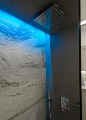 a bathroom with a painting of a mountain at Sofia Central View Loft in Sofia