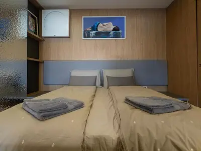 a bed in a room with two pillows on it at Sofia Central View Loft in Sofia