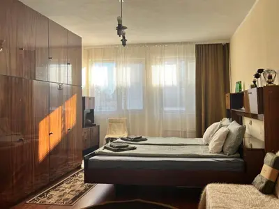 a small bedroom with a bed and a window at Cosy home in the heart of Bansko in Bansko