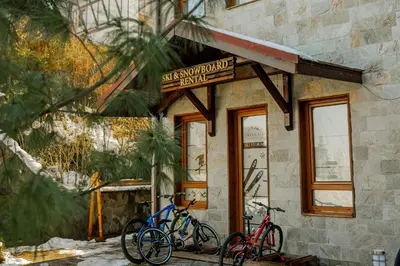 two bikes parked in front of a building at Green Life Private Apartment D27 in Bansko