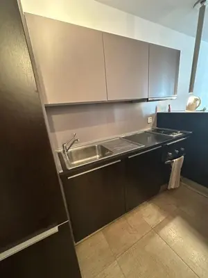 a kitchen with a sink and a counter top at GALAXY apartment in Sofia
