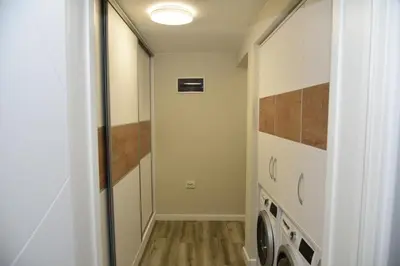 a laundry room with a washer and dryer at C&A Apartment in Gotse Delchev