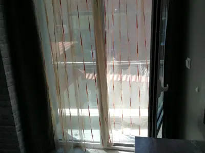 a sliding glass door with a view of a patio at Studio 11 Plovdiv in Plovdiv