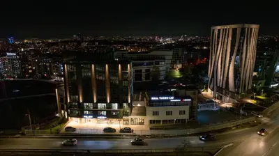 a view of a city at night with buildings at NOVITA Hotel Sofia FREE UNDERGROUND PARKING in Sofia