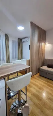 a living room with a table and a couch at Lux Apartment B11 in Bansko