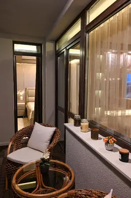 a room with a table and a chair and a window at All Seasons Apartment 2 in Sofia