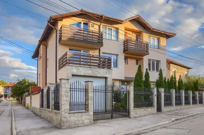 a house with a fence in front of it at Rila North Samokov in Samokov