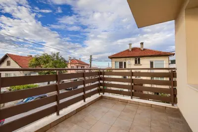 a balcony of a house with a fence at Rila North Samokov in Samokov