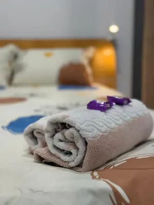 a towel sitting on top of a bed at Botev MiniHub Hub 1 Modern Studio at Botev 88 in Sofia