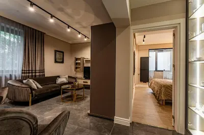 a living room with a couch and a bed at Exclusive Luxury Central Apartment in Sofia