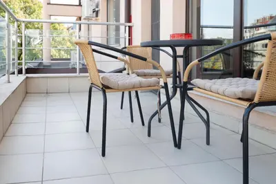 a table and chairs sitting on a balcony at Апартамент за гости НИКОЛОВА in Plovdiv