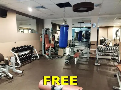 a gym with a punching bag in the middle at Alpin Art Studio in Hotel Iceberg - Free Pool, Sauna and Fitness in Borovets
