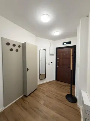 a room with a hallway with a door and a mirror at Harmony Apartment by 7th Sence in Sofia