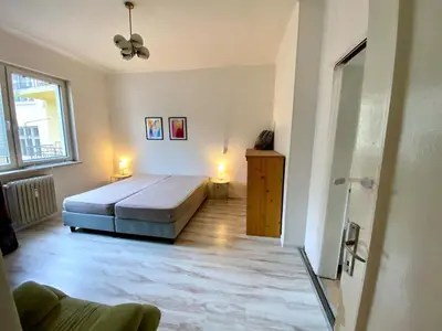 a bedroom with a large bed in a room at Comedy Theatre apartments in Sofia