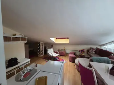 a living room with a couch and a table at Аppartment Dreams in Pamporovo