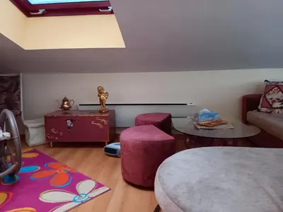 a living room with a couch and a table at Аppartment Dreams in Pamporovo