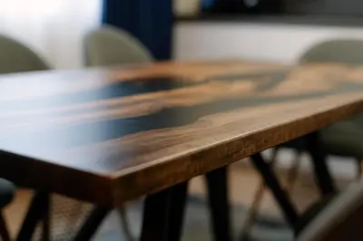 a close up of a wooden table with chairs at 1 minute to main Street Grafa, NDK, FREE Parking, 3BDR in Sofia