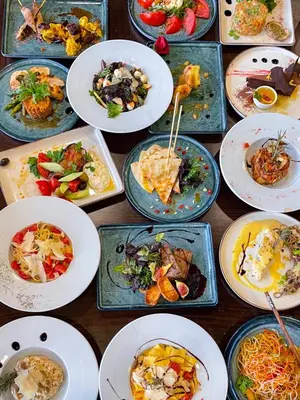 a bunch of plates of food on a table at Apartment with an amazing view - near Bansko in Razlog