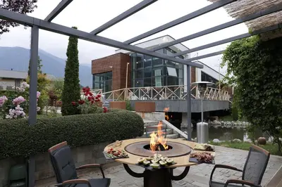 a patio with a fire pit in front of a building at Apartment with an amazing view - near Bansko in Razlog