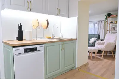 a kitchen with a sink and a dishwasher at Villa Natalia in Kremen