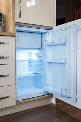 an empty refrigerator with its door open in a kitchen at Best Central Lux Studio in Bansko