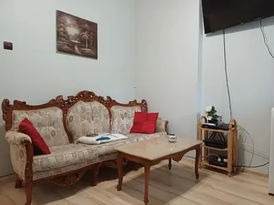 a living room with a couch and a table at Ktt house in Plovdiv
