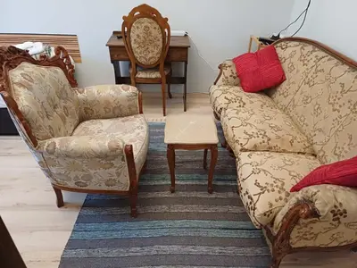 a living room with two chairs and a couch at Ktt house in Plovdiv