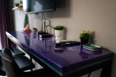 a purple desk with plants on top of it at Comfy&Chick Central Apartment, Free Street Parking in Blagoevgrad