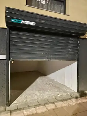 a garage door is open on the side of a building at Casa Nova with Free Garage Parking in Plovdiv