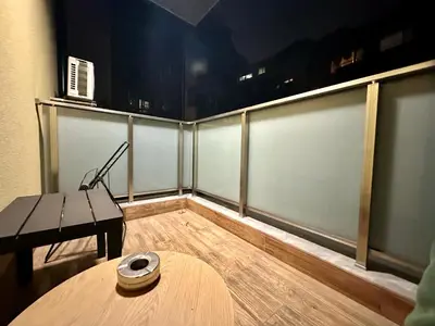 a room with a table and a bench in a room at Casa Nova with Free Garage Parking in Plovdiv